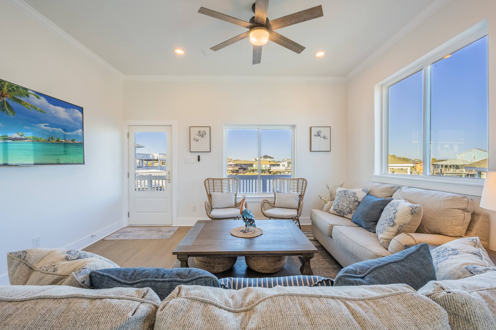 Living room overlooking the waterfront deck at Pelican Lookout