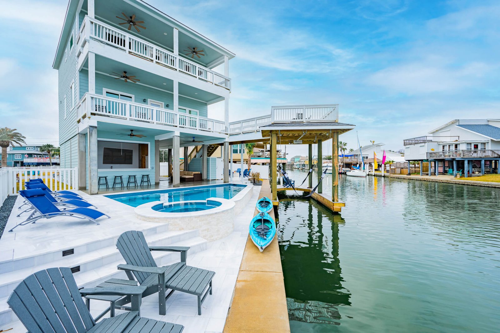 Waterfront exterior with private pool and canal access at Pelican Lookout