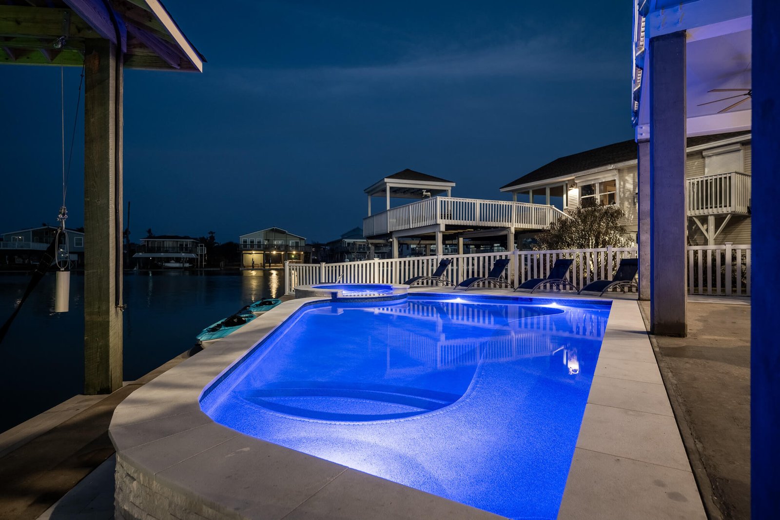 Pelican Lookout private pool and hot tub illuminated at night