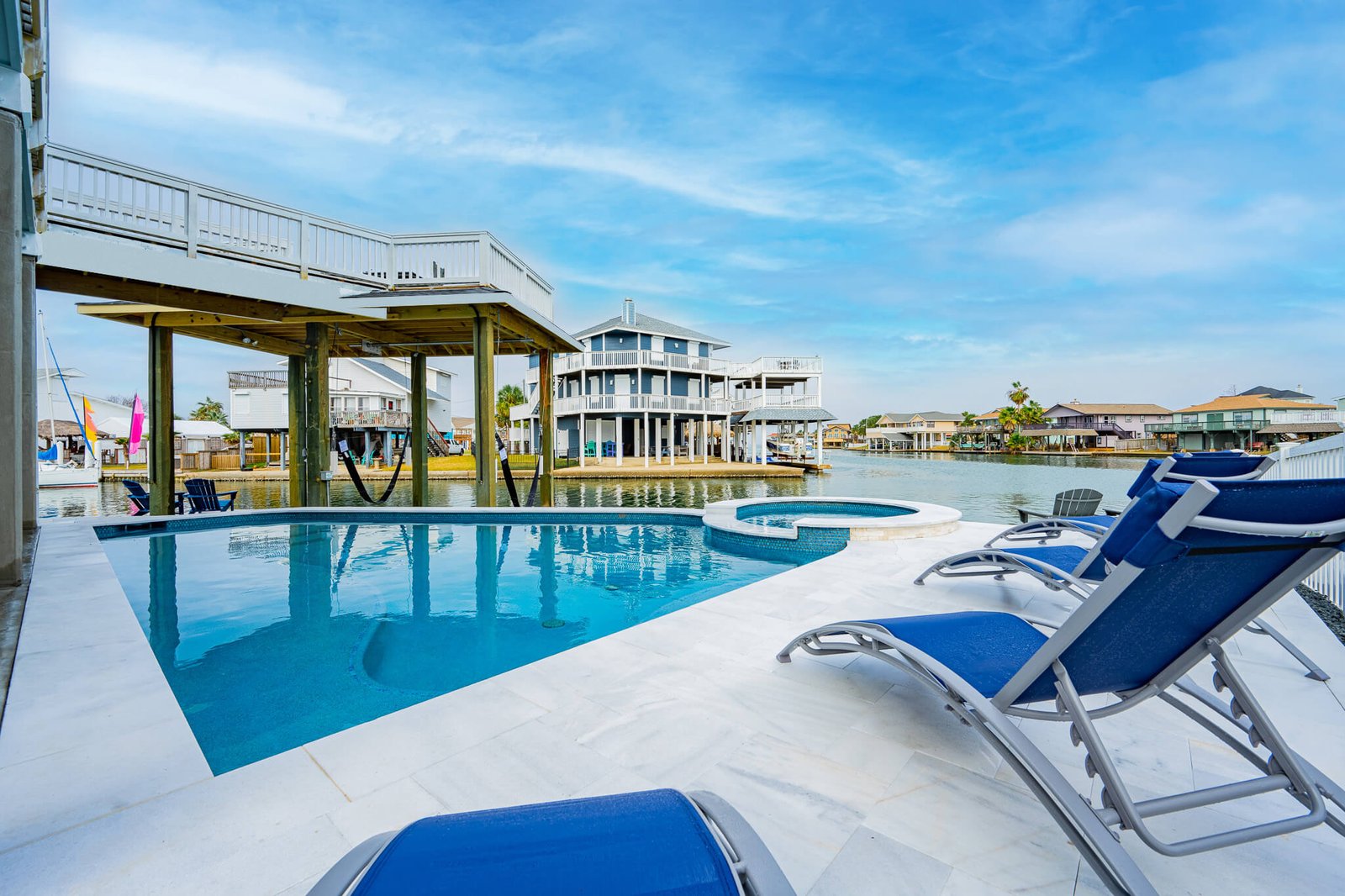 Poolside loungers overlooking the canal at Pelican Lookout