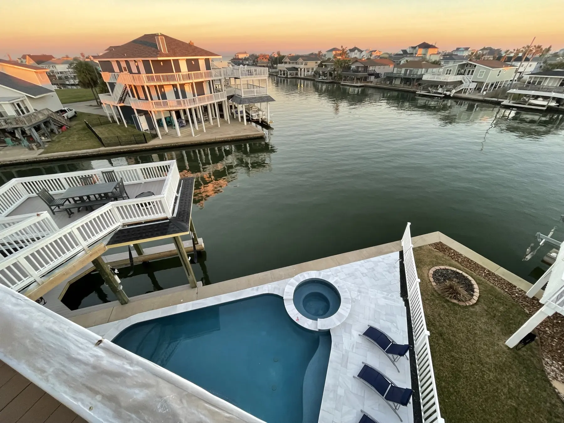 Sunset over the Pelican Lookout pool and Jamaica Beach canal